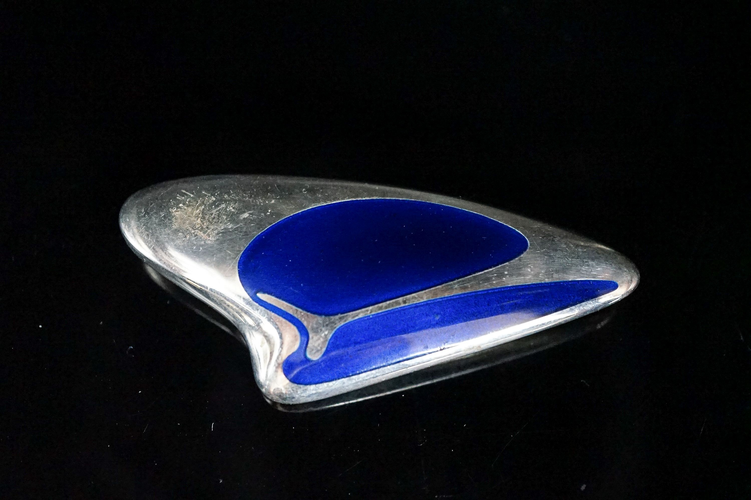 A Henning Koppel for Georg Jensen sterling and blue enamel amorphic brooch, no. 314, 69mm.